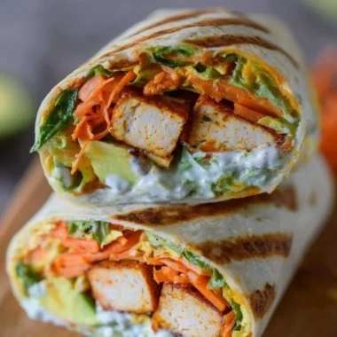 Buffalo Tofu Wrap with fresh vegetables in a whole grain tortilla