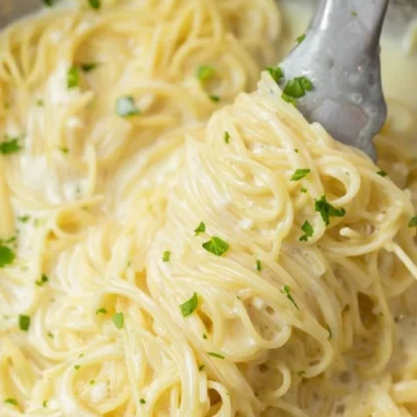 Creamy Garlic Parmesan Pasta served in a bowl with herbs and grated cheese