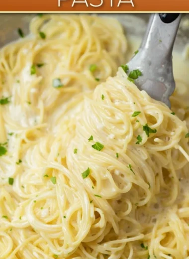 Creamy Garlic Parmesan Pasta served in a bowl with herbs and grated cheese