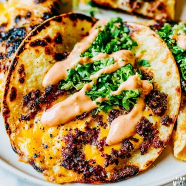 Delicious and crispy smash tacos served with fresh toppings and sauces