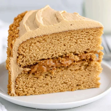 Delicious Biscoff Cake topped with creamy frosting and Biscoff crumbs.