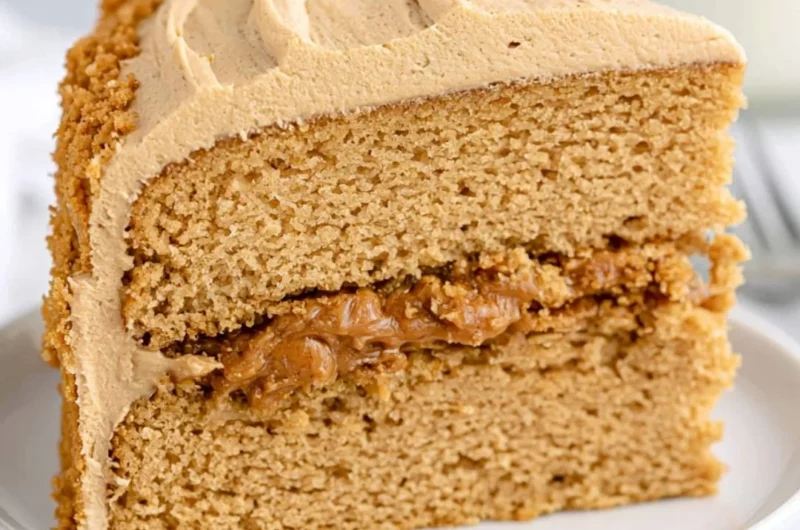 Delicious Biscoff Cake topped with creamy frosting and Biscoff crumbs.