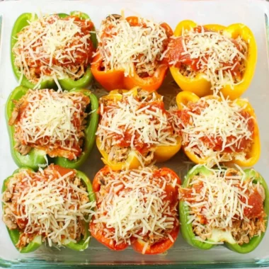 Delicious Chicken Parm Stuffed Peppers served on a plate with cheese and sauce