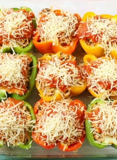 Delicious Chicken Parm Stuffed Peppers served on a plate with cheese and sauce