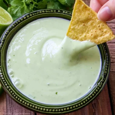 Delicious cilantro lime cream served in a bowl, garnished with fresh cilantro leaves