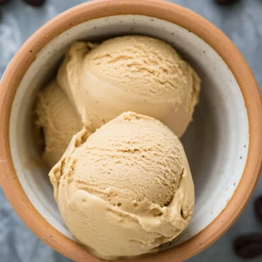 Delicious coffee ice cream in a bowl topped with chocolate sprinkles