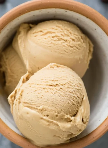 Delicious coffee ice cream in a bowl topped with chocolate sprinkles
