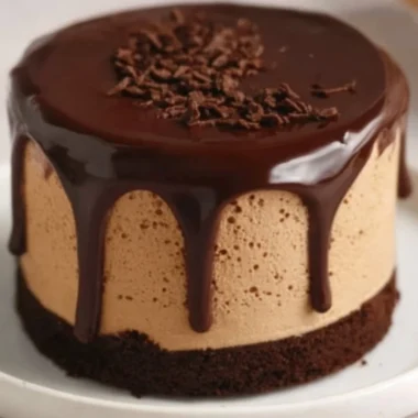Delicious coffee mousse topped with dark chocolate ganache in a dessert bowl.