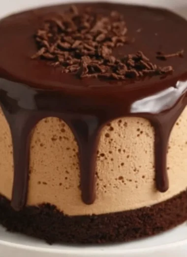 Delicious coffee mousse topped with dark chocolate ganache in a dessert bowl.