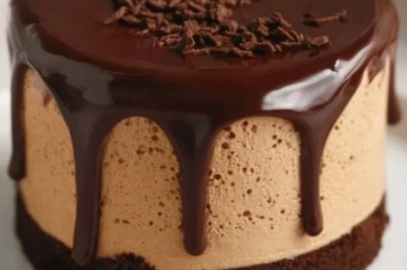 Delicious coffee mousse topped with dark chocolate ganache in a dessert bowl.