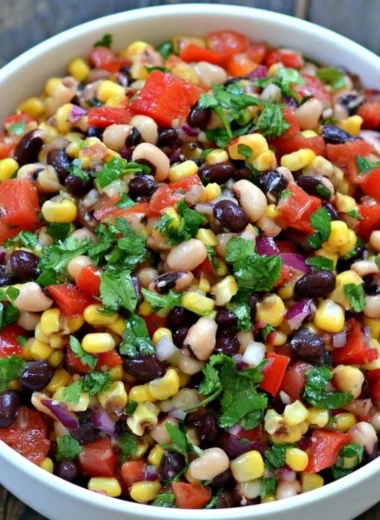 Bowl of vibrant Cowboy Caviar with fresh vegetables and beans