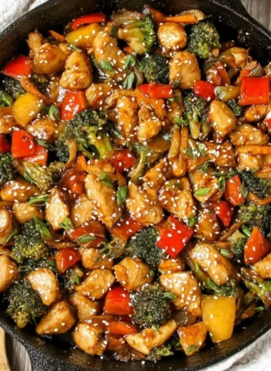 Colorful easy chicken stir fry with vegetables in a wok.