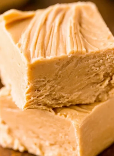 Delicious easy peanut butter fudge cut into squares on a plate