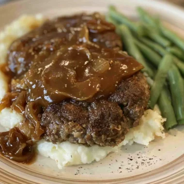 Delicious easy Salisbury steak served with gravy on a plate
