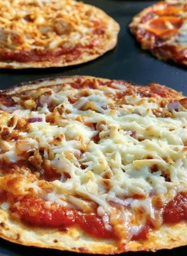 Delicious homemade griddle pizza topped with fresh ingredients.