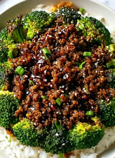 A plate of cooked hamburger meat and broccoli, showcasing a nutritious meal option.