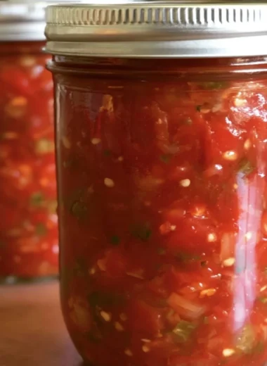 Bowl of vibrant homemade salsa made with fresh tomatoes and herbs