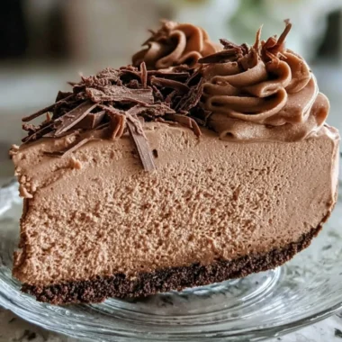Keto Fluffy Chocolate Mousse served in a bowl with a sprinkle of cocoa.