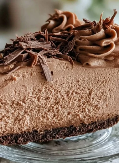 Keto Fluffy Chocolate Mousse served in a bowl with a sprinkle of cocoa.