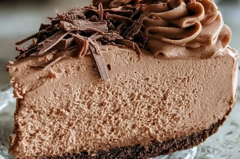 Keto Fluffy Chocolate Mousse served in a bowl with a sprinkle of cocoa.