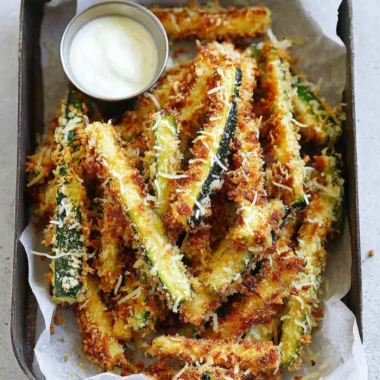 Plate of crispy Parmesan Zucchini Fries ready to be enjoyed.