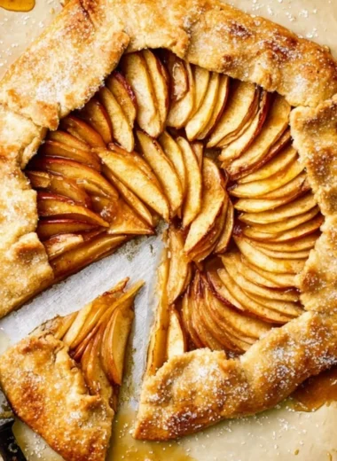 Freshly baked rustic French apple tart with a golden crust and apple filling.