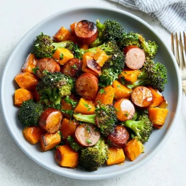 Sheet pan meal featuring sausage and roasted sweet potatoes