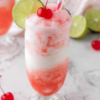 Shirley Temple Ice Cream Float served in a glass with cherry on top
