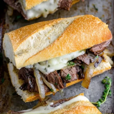 Delicious steak sandwich served with fresh ingredients and sauces