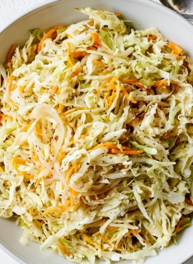 Bowl of fresh vineger coleslaw with vibrant vegetables