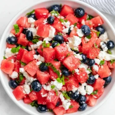 Delicious watermelon feta salad with mint and olives in a bowl