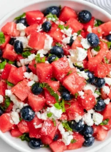 Delicious watermelon feta salad with mint and olives in a bowl