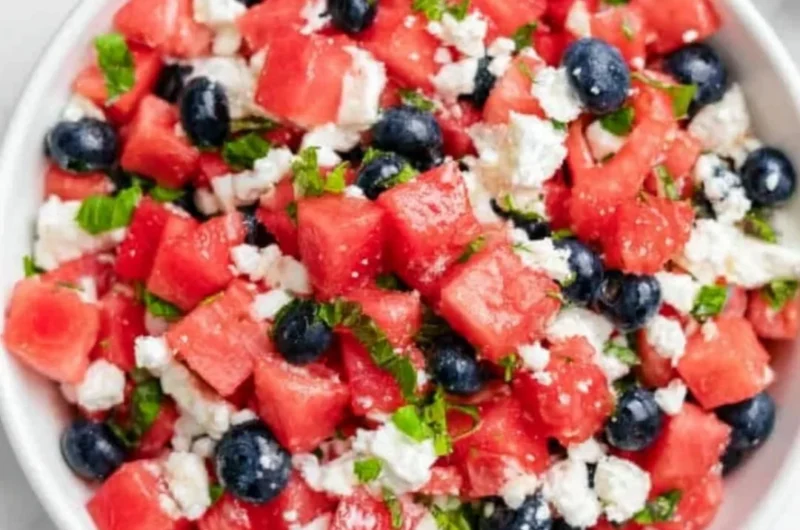 Delicious watermelon feta salad with mint and olives in a bowl