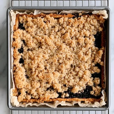 Delicious blackberry pie bars with a golden crust and fresh blackberries on top
