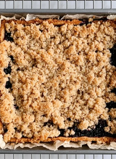Delicious blackberry pie bars with a golden crust and fresh blackberries on top
