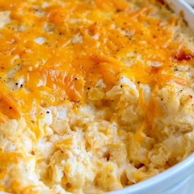 Delicious cheesy hashbrown casserole with melted cheese and crispy topping