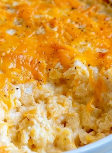Delicious cheesy hashbrown casserole with melted cheese and crispy topping
