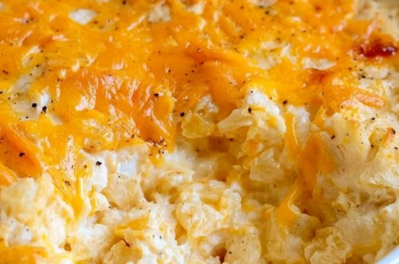 Delicious cheesy hashbrown casserole with melted cheese and crispy topping