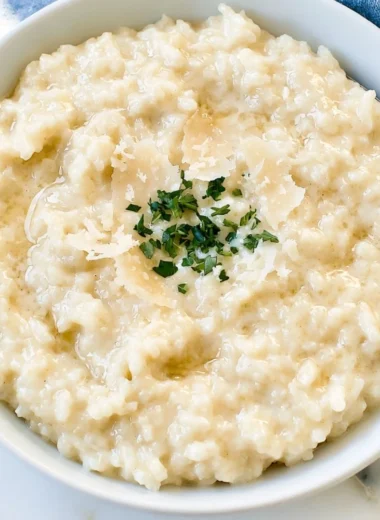 Creamy Parmesan Risotto topped with fresh parsley and parmesan cheese