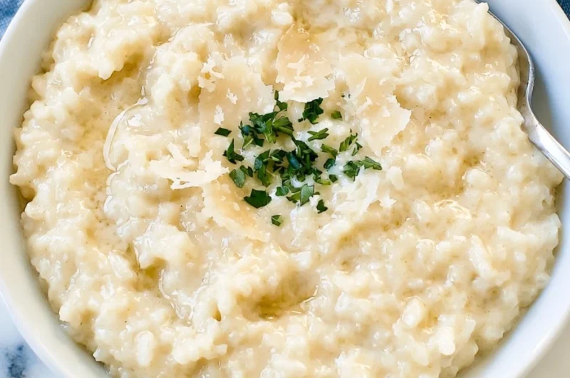 Creamy Parmesan Risotto topped with fresh parsley and parmesan cheese