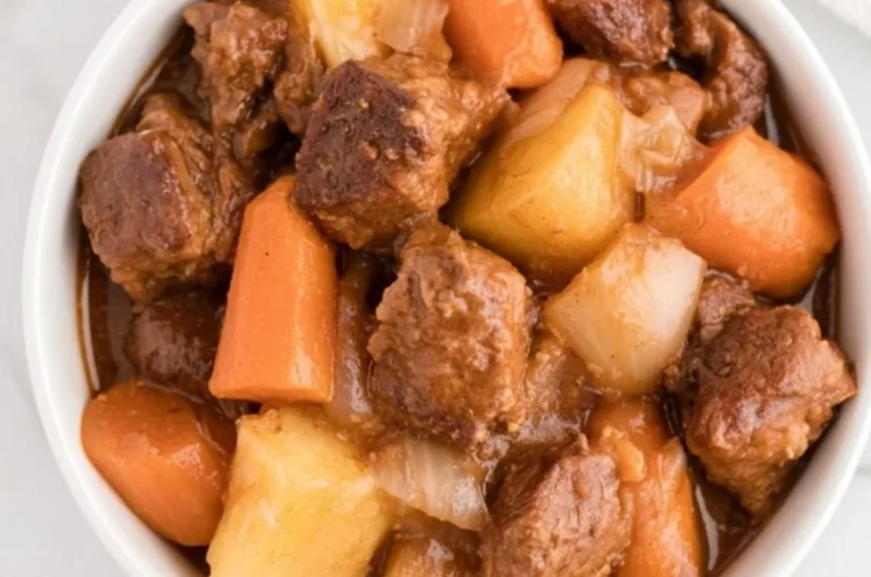 Delicious Crockpot beef stew simmering with vegetables and tender meat.