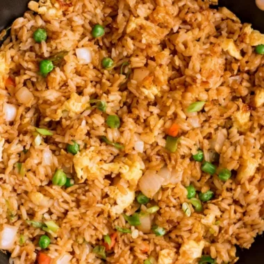 Bowl of easy egg fried rice garnished with green onions