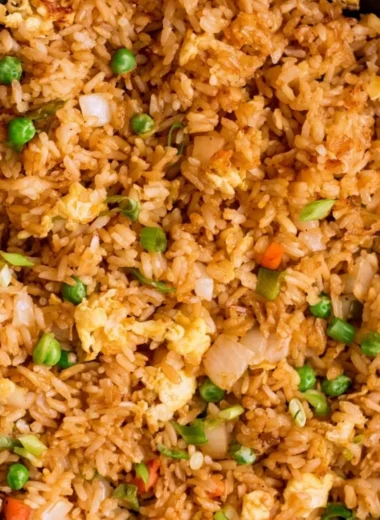 Bowl of easy egg fried rice garnished with green onions