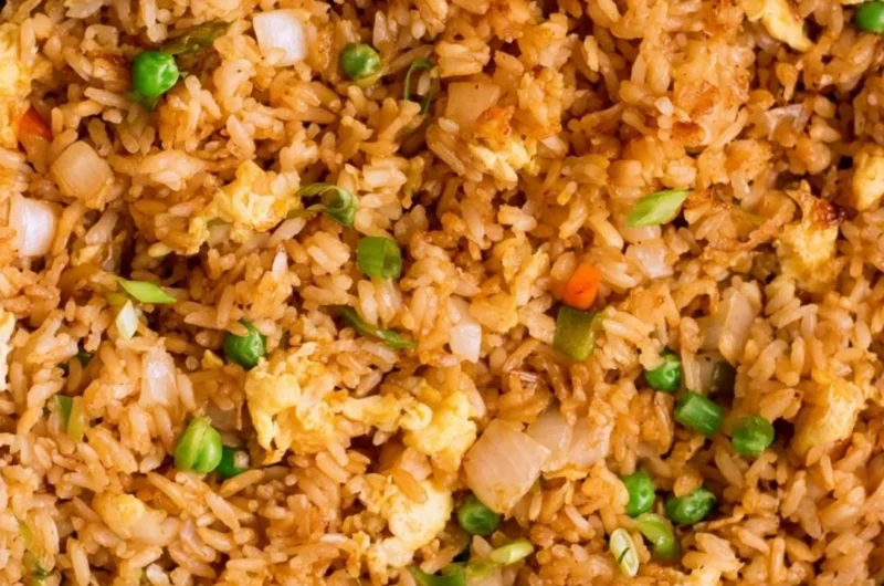 Bowl of easy egg fried rice garnished with green onions