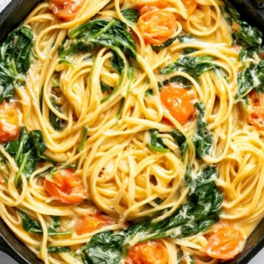 Delicious bowl of Garlic Butter Pasta topped with herbs and parmesan cheese