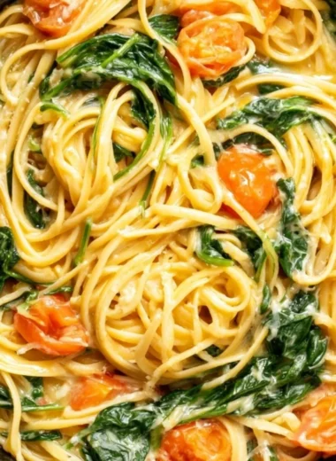 Delicious bowl of Garlic Butter Pasta topped with herbs and parmesan cheese