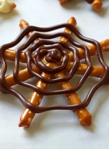 Delicious chocolate pretzel spider web dessert for Halloween celebrations