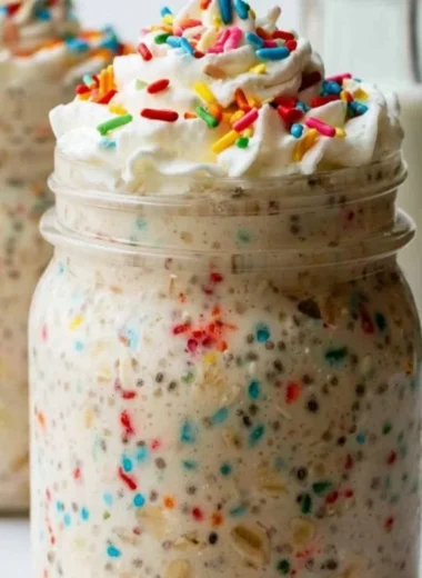 Delicious bowl of healthy overnight oats topped with fresh fruits and nuts