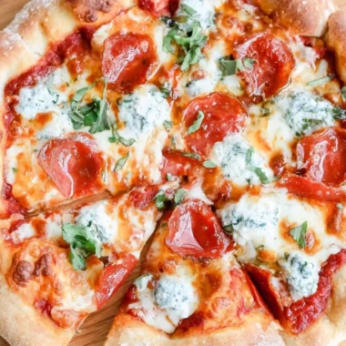 Delicious Hot Honey Pizza topped with spicy honey drizzles and fresh ingredients.