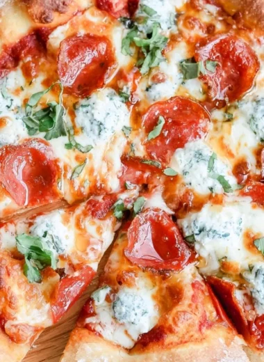 Delicious Hot Honey Pizza topped with spicy honey drizzles and fresh ingredients.